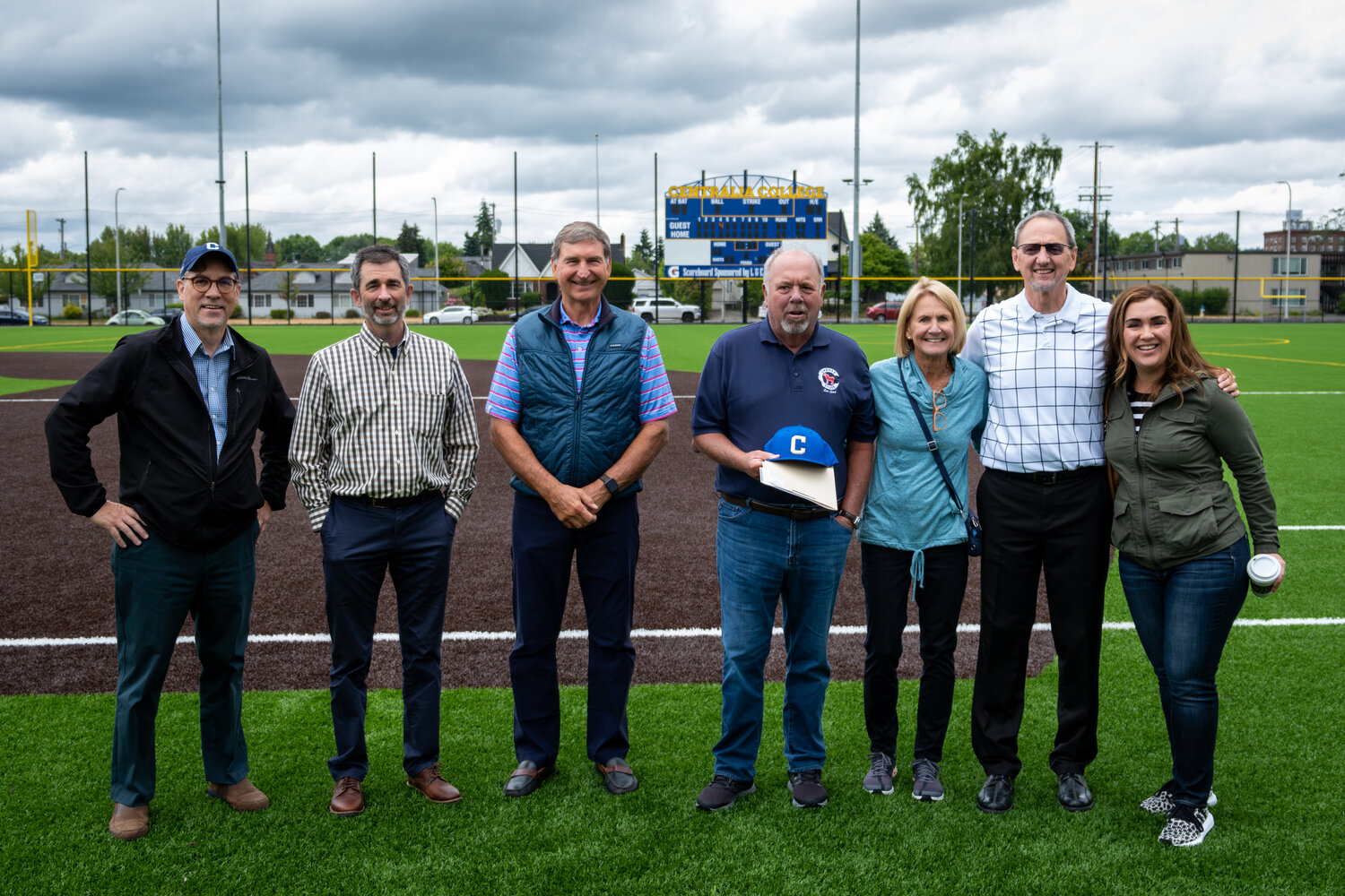 Centralia College President Dr. Bob Mohrbacher (far left) and retired Centralia College Athletic Director Bob Peters (second from right) meet with representatives from the Ben B. Cheney Foundation at the Bob Peters Field at Centralia College. Courtesy photo from Centralia College.